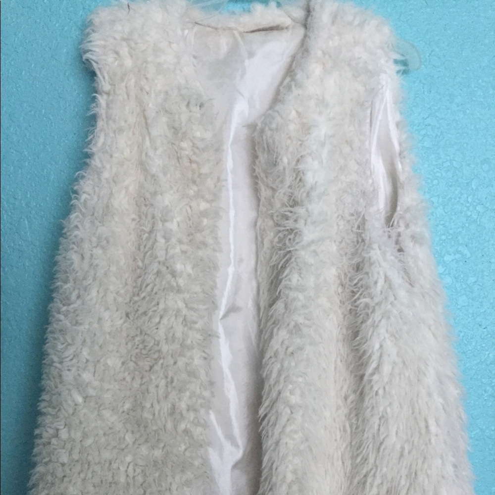 This is a large white poncho from Bobbie brooks
